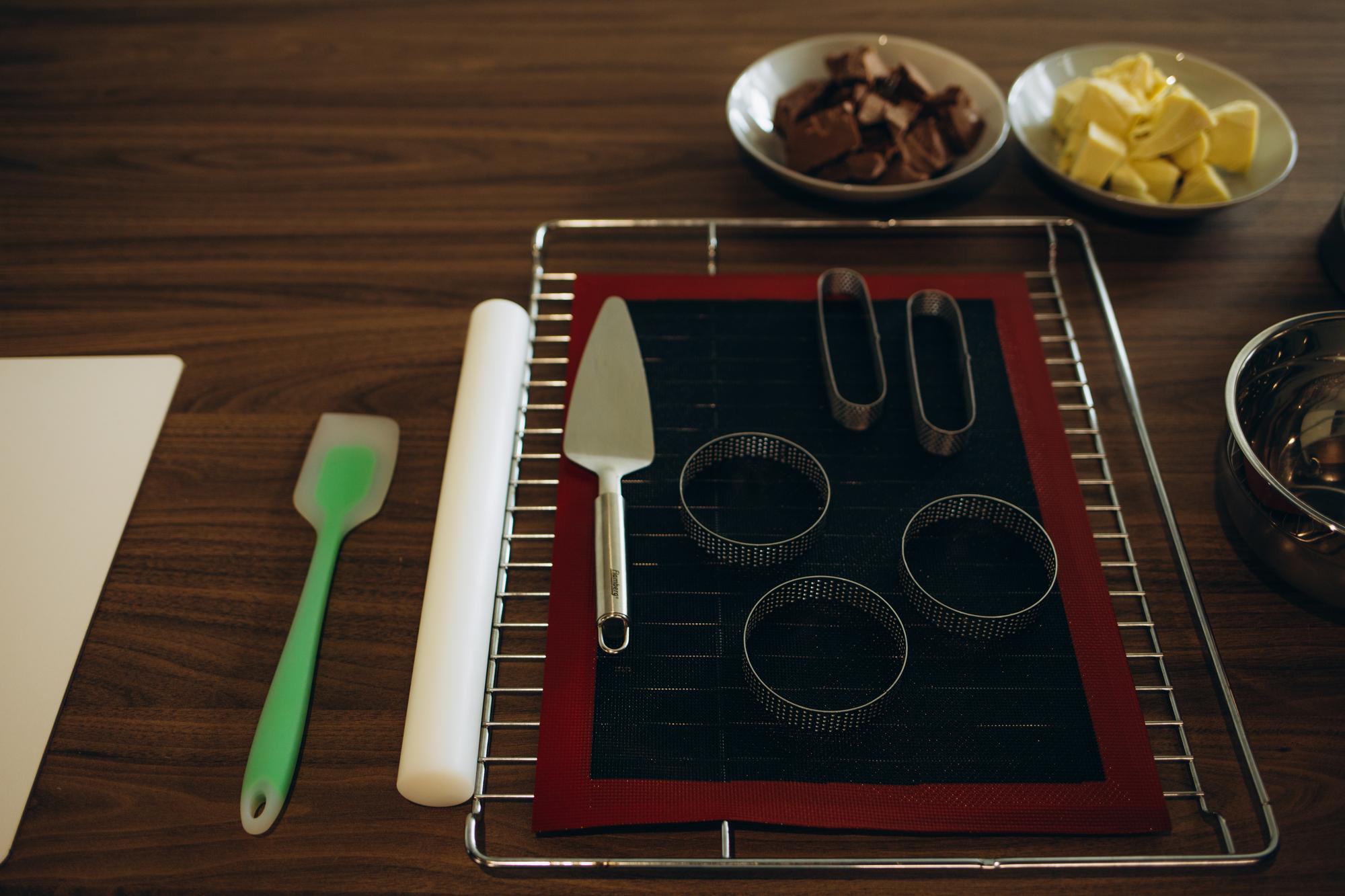 workstation with plated tasting portions and tech tools